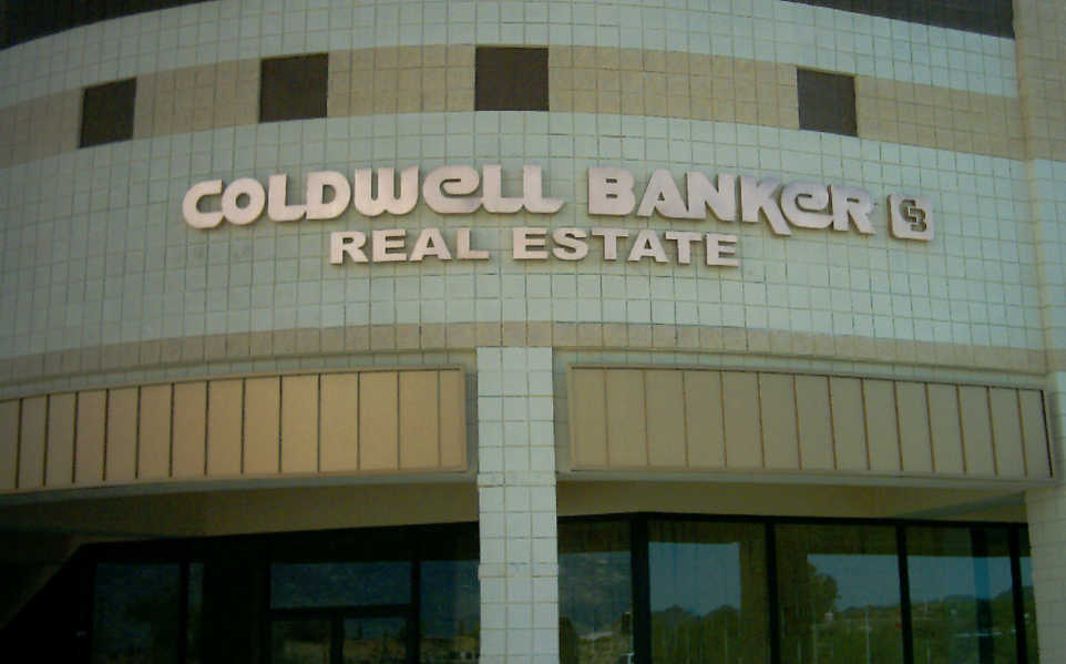 Coldwell Banker Real Estate reverse pan channel letters on a curved building front 
